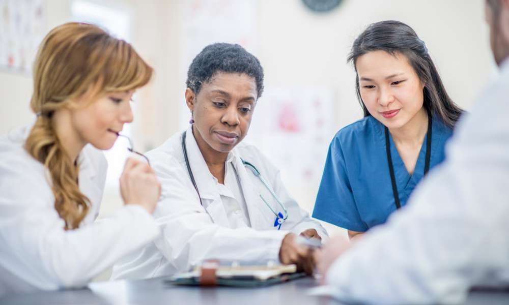doctor reviewing medication management in Orlando plan