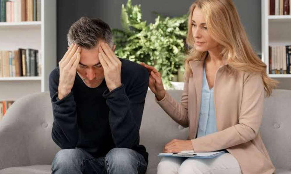 Person struggling with anxiety while trying to manage daily responsibilities, work tasks, and emotional stress