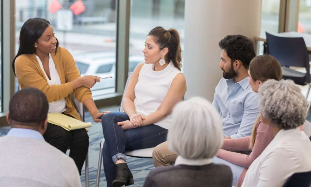 Supportive conversation helping an individual manage depression symptoms and build emotional resilience