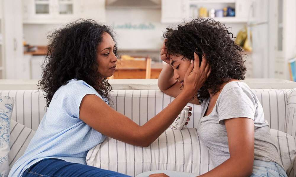 Professional support helping an individual take early action to manage depression symptoms and emotional stress