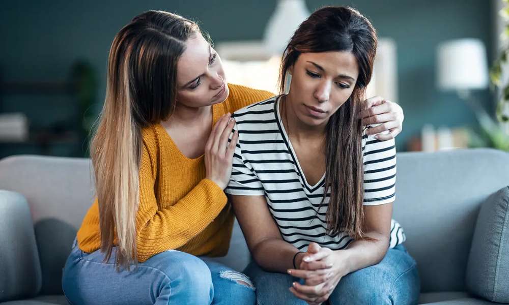 Supportive conversation helping a person identify depression symptoms and seek help early