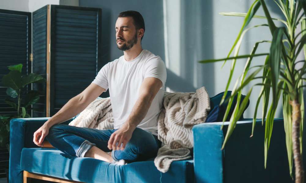 Person practicing healthy daily habits to reduce anxiety naturally and improve emotional wellbeing