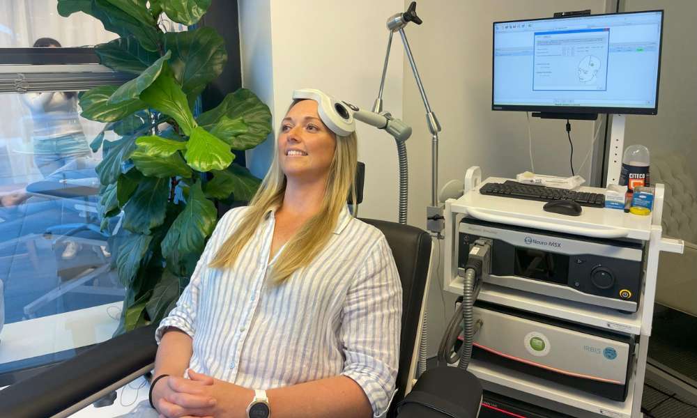 Person undergoing TMS therapy to support mental wellness and recovery